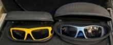2 Pairs of Oakley Sunglasses with hard cases