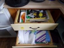 Contents of Top (2) Drawers to Right of Stove, Cooking Utensils and Towels