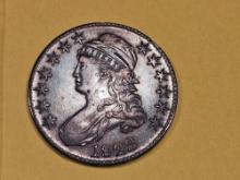 * 1823 Capped Bust Half Dollar in About Uncirculated Plus!