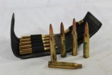 One nylon flip open belt ammo holder with 9, 25-06 rounds SP and 2 fired cases.