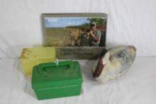 One book, The Story of Larry Potterfield, MidWay's, one Feather-Lite plastic duck decoy and two