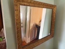 BEAUTIFUL MIRROR WITH ORNATE FRAME. SOME CHIPS TO THE WOOD. APPROX 35 X 29"