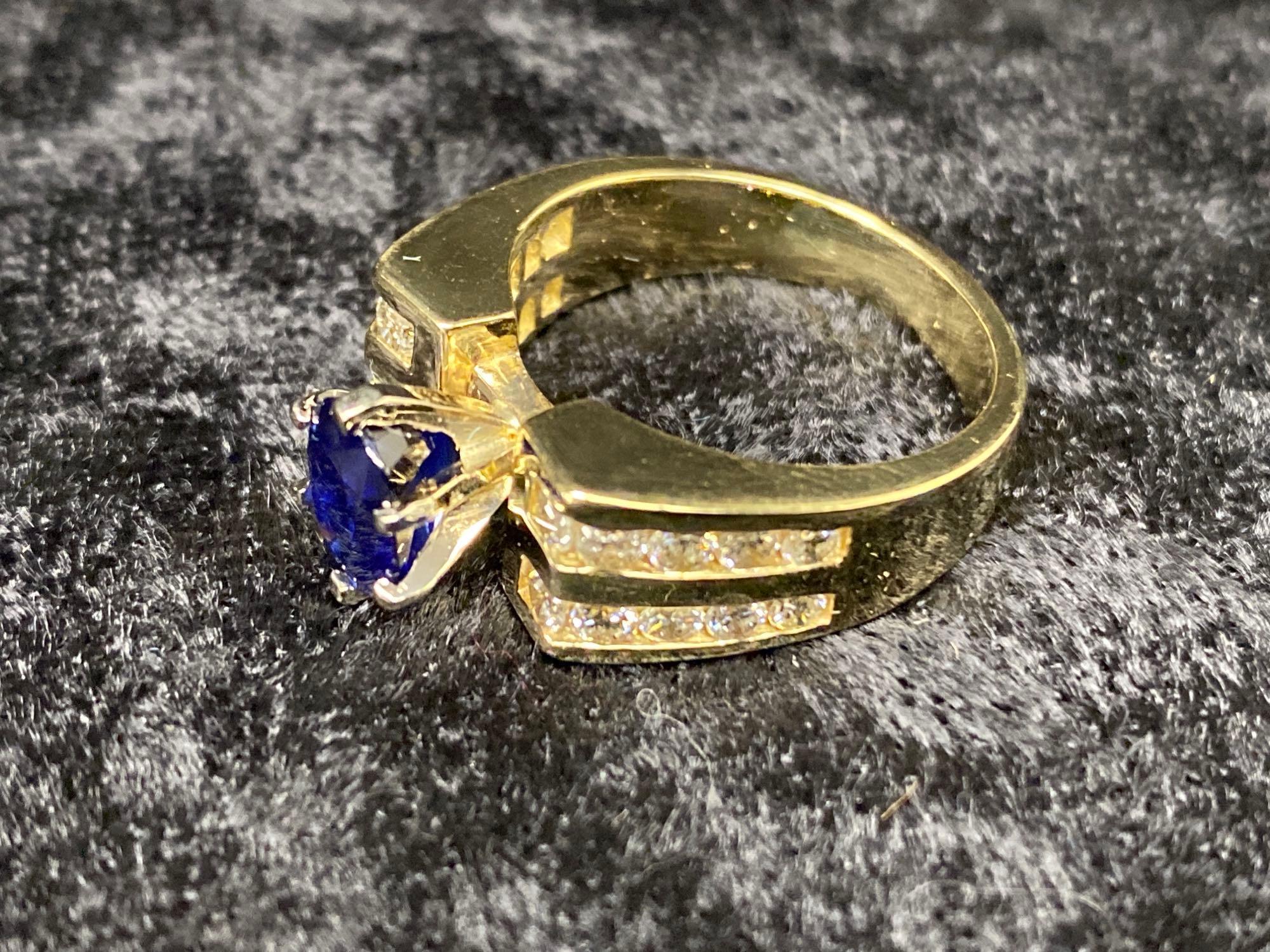 One Beautiful Ring Set with Fine Blue Sapphire and Side Diamonds in 14k Yellow Gold