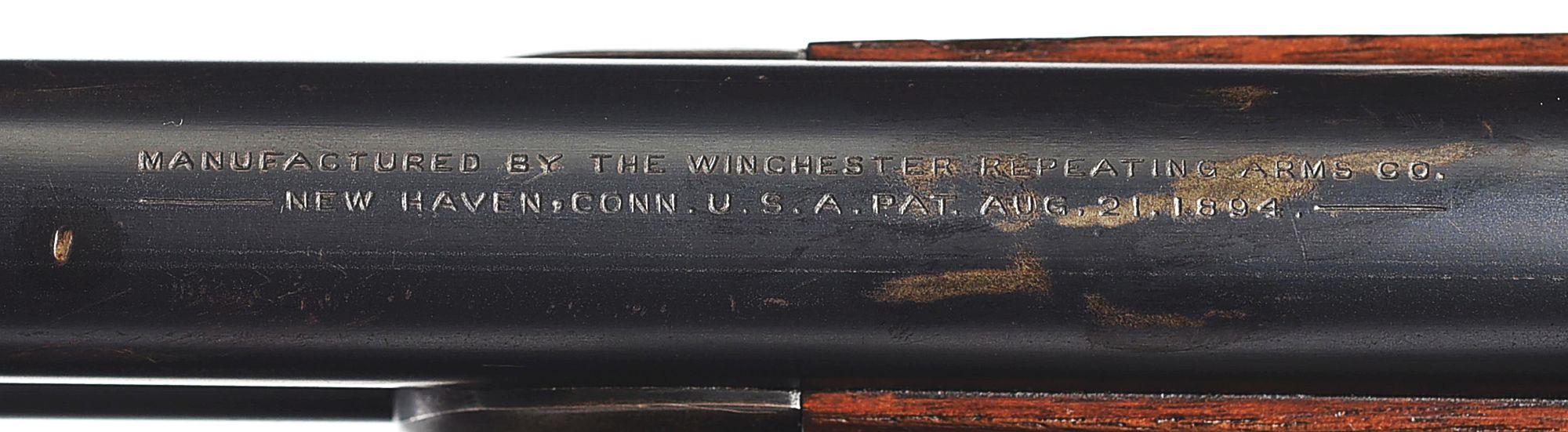 (C) WINCHESTER MODEL 1894 LEVER ACTION RIFLE WITH SWISS BUTT PLATE.