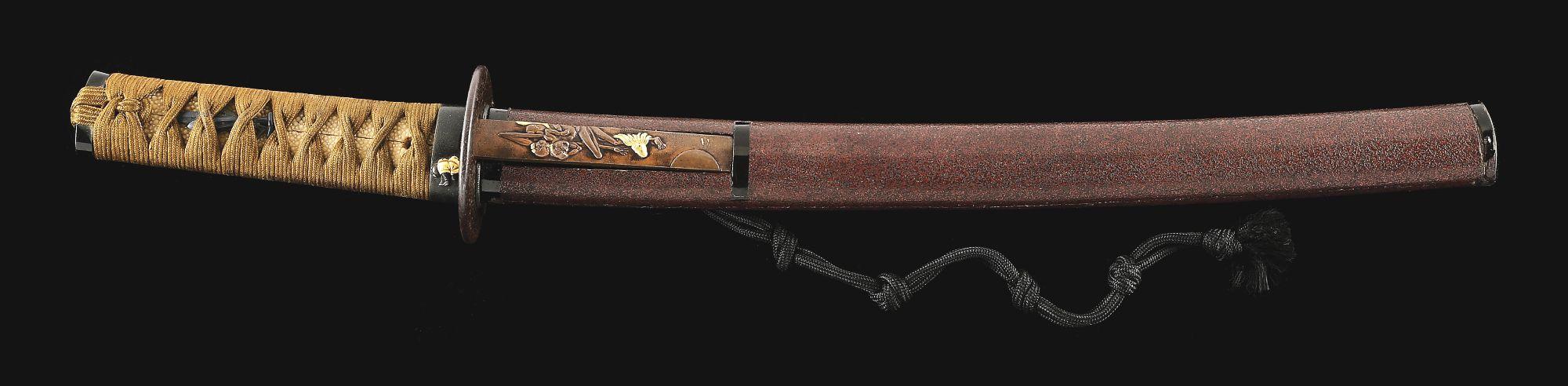 A LARGE TANTO SIGNED BY ECHIZEN KANETANE, WITH AN UNUSUAL INSCRIPTION REGARDING FORGING, IN KOSHIRAE