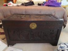 Carved chest with ornate lock