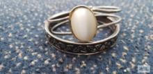 Silver colored bangle bracelet and silver colored bangle bracelet with white stone