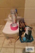 lot of crafting supplies and plastic storage bin