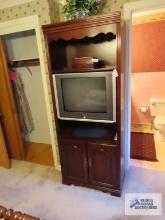 Entertainment center with storage. Located upstairs. Bring help to remove.