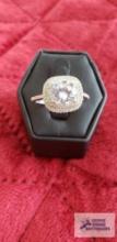 Sterling silver ring with large diamond and small diamonds surrounding, 3.6 G with half carat total