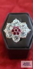 Silver colored ring with blue and pink gemstones in flower-like shape, marked 925 Thailand, 7.4 G.