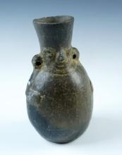 4 5/8" tall miniature Human Effigy Chimu Bottle recovered in S. America. Solid condition.