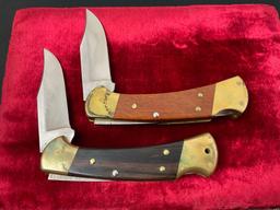 Pair of Vintage Buck Folding Knives, models 112 & 432 w/ Leather Sheaths
