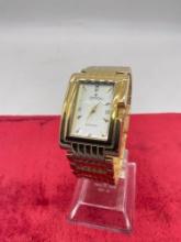 Croton Diamond japan movt. stainless steel gold tone wristwatch in good cond