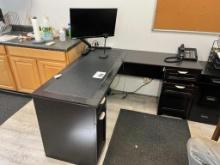 Black corner office desk w/ 2 file cabinets & monitor, side table.
