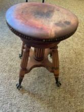 18" T Antique adjustable, swivel, ball claw legs, piano stool