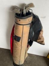 Beige Datrek golf bag and 8 assorted golf clubs
