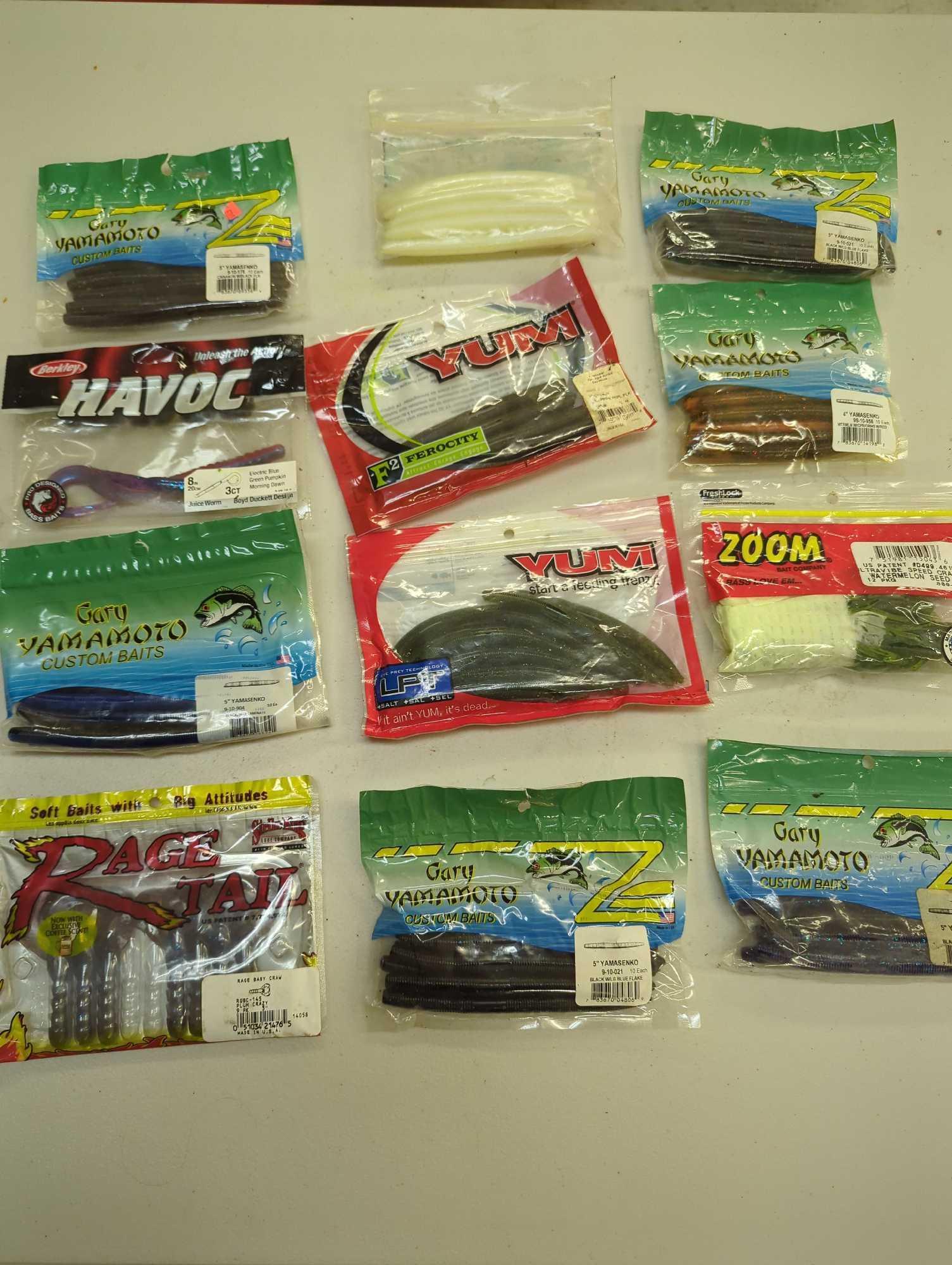 Aqua Sterilite stackable storage crate and contents including various worm fishing lures. Comes as