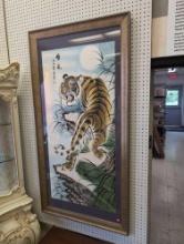 REPRODUCTION CHINESE PRINT DEPICTING A TIGER ON A LEDGE. SIGNED IN CHINESE SYMBOLS. DISPLAYED IN A