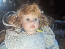 (GAR) Red Haired and Blue Eyed Porcelain Doll Wearing a Blue Dress with White Lace Overlay,