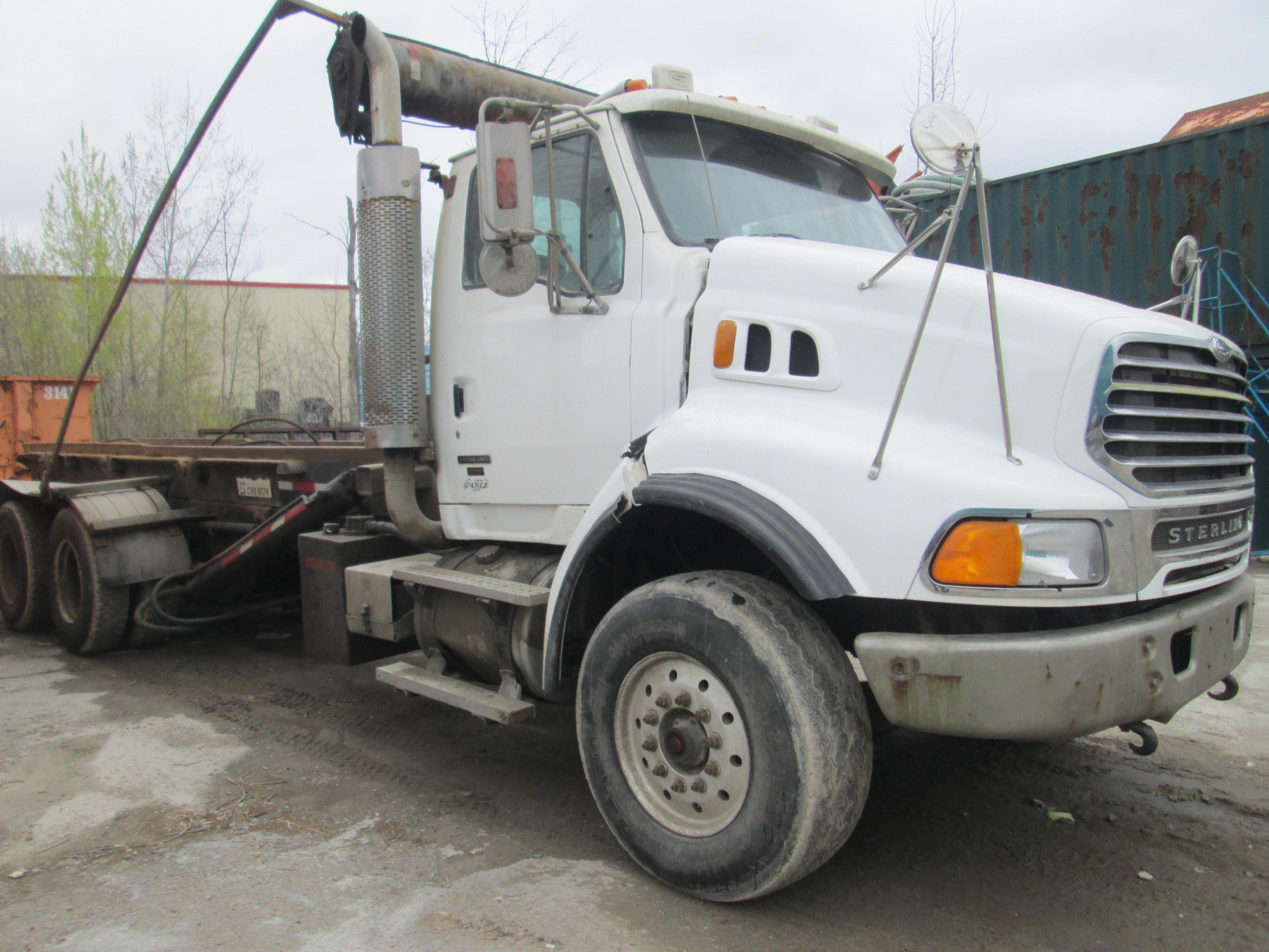 ROLLOFF TRUCK 2007 Sterling L-Line Tandem / axle Roll off truck SN 2FZHAZCV47AY63591, equipped with