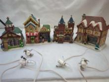 CHRISTMAS VILLAGE GROUP OF 4. TWO CHURCHES, CANDY STORE AND ONE HOME. WITH LIGHTS.