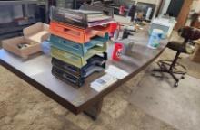 Table with contents and Brown, Green and Blue Stool Chairs, Staple gun and Box, Red Milwaukee Box