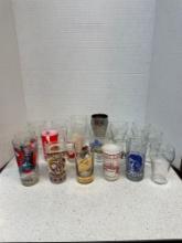 Fun set of vintage drinking glasses, including 1976 penguin, Rawlings, football glass, JFK glass,