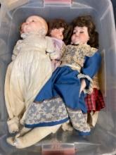 Tote full of vintage dolls