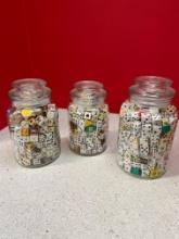 3 Glass jars, full of dice