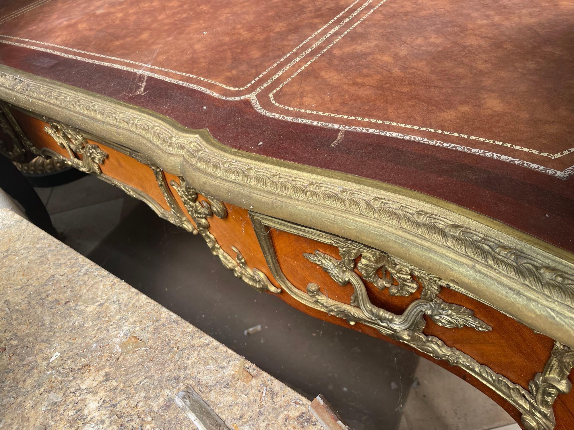 1960s French Louis XV Style Ornate Carved Wood Desk With Figural Accents and Leather Inlaid Top