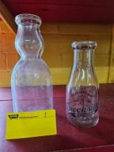 2 milk bottles, one from Brookside Louisville